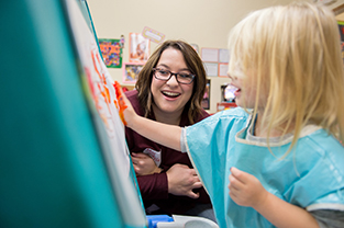 A education student teaching a child